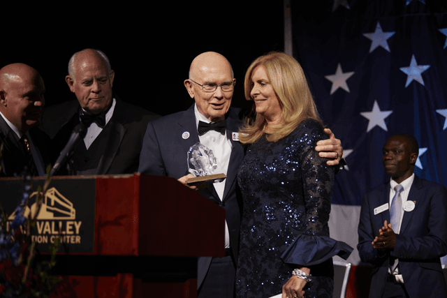 President Dallin H. Oaks of the First Presidency stands with Ruth Todd, emcee for the Freedom Awards Gala, an event of America’s Freedom Festival at Provo, Utah, a local nonprofit, on Thursday, July 1, 2021. He received the award for his lifelong work to promote the values of God, family, freedom and country.